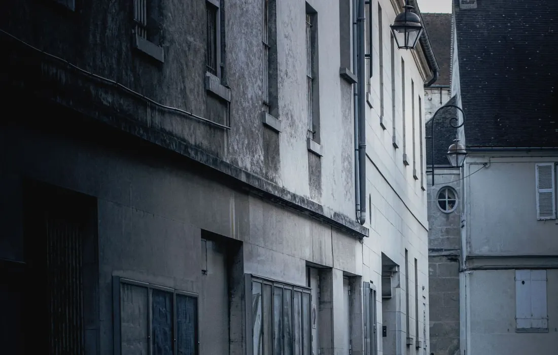 Dramatic view of an empty wet street in Compiègne, France, after rain.