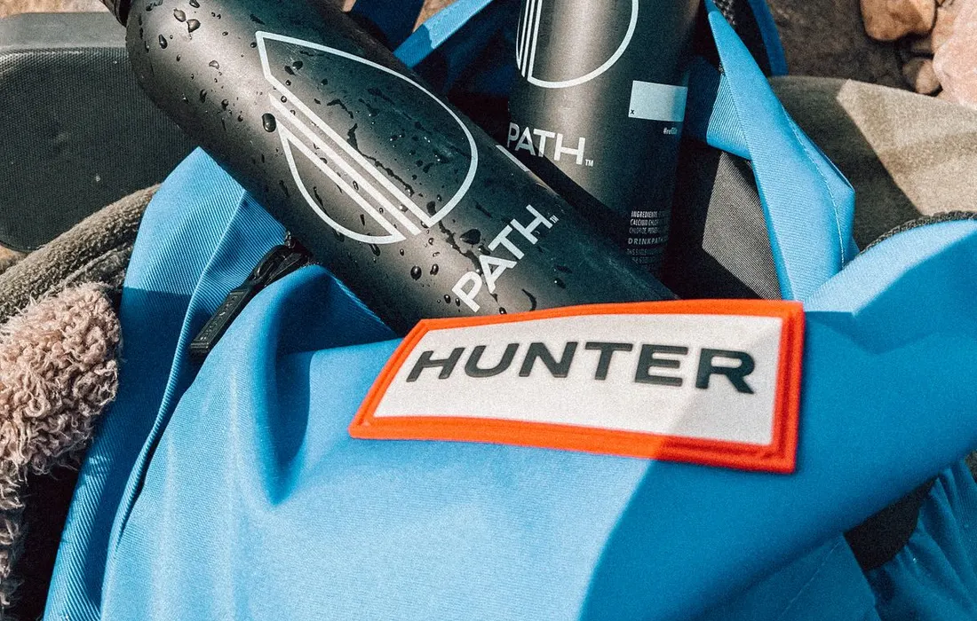 Reusable water bottles in a blue backpack.