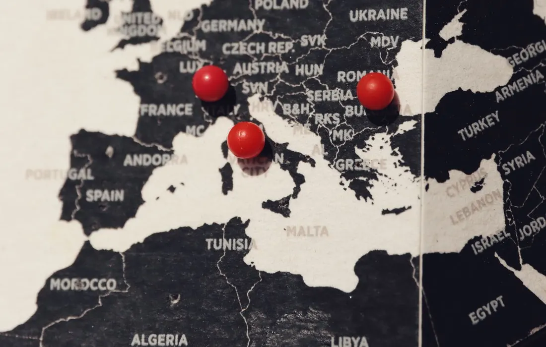 A map of Europe marked with red pins.