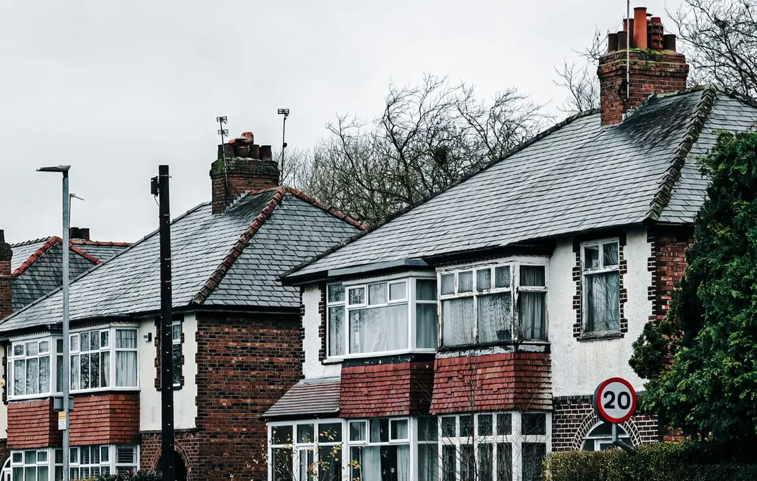 Charming view of classic houses on a rainy day in Manchester, England.