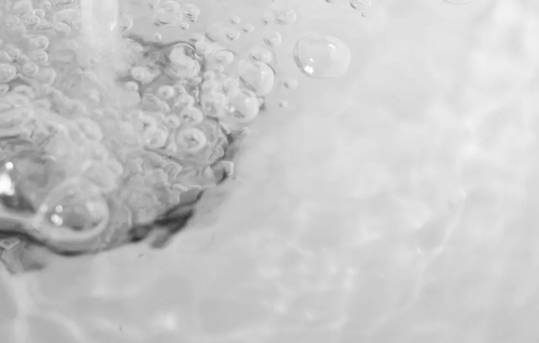 Water flowing into a kitchen sink.
