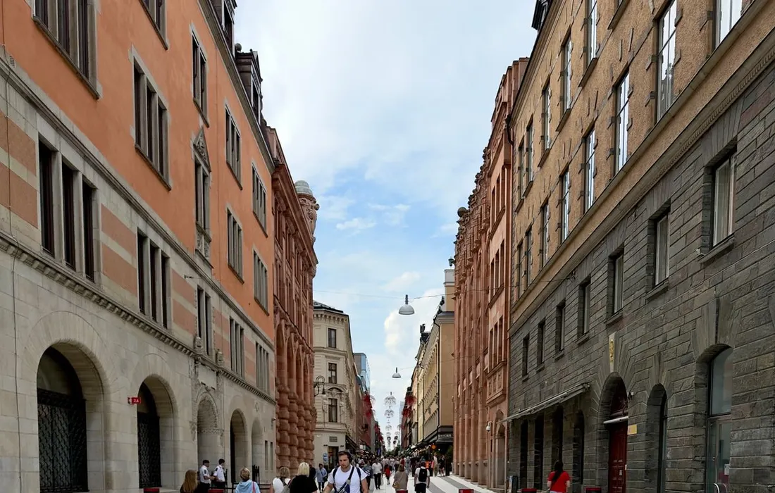 A pedestrian street lined with buildings in Stockholm.