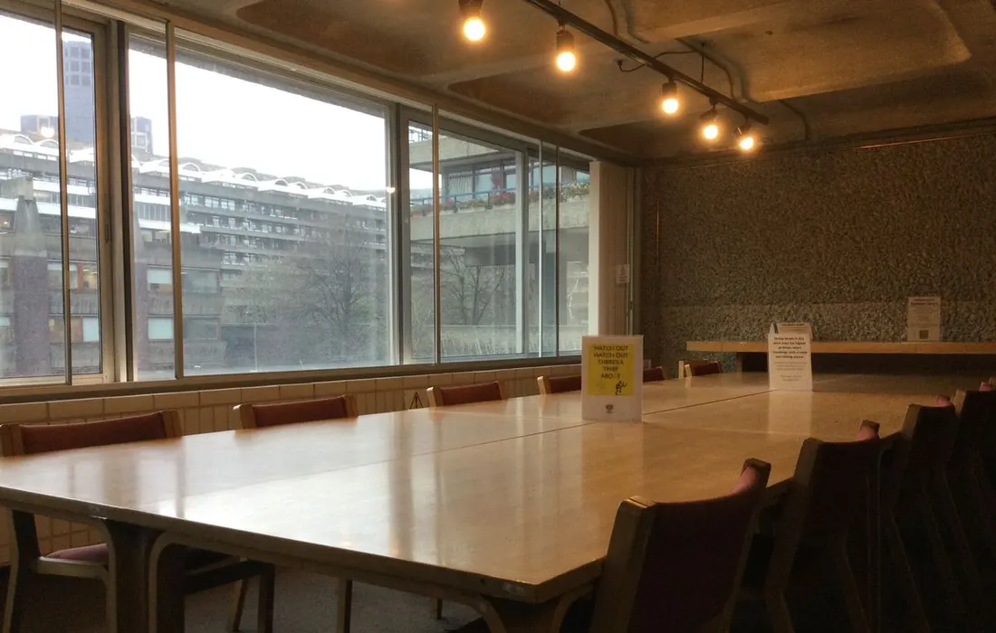 A meeting table and chairs inside a London library building.