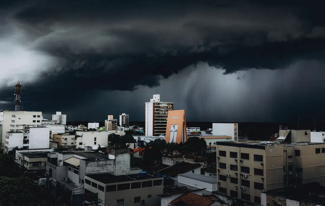 Dark clouds above a city skyline.