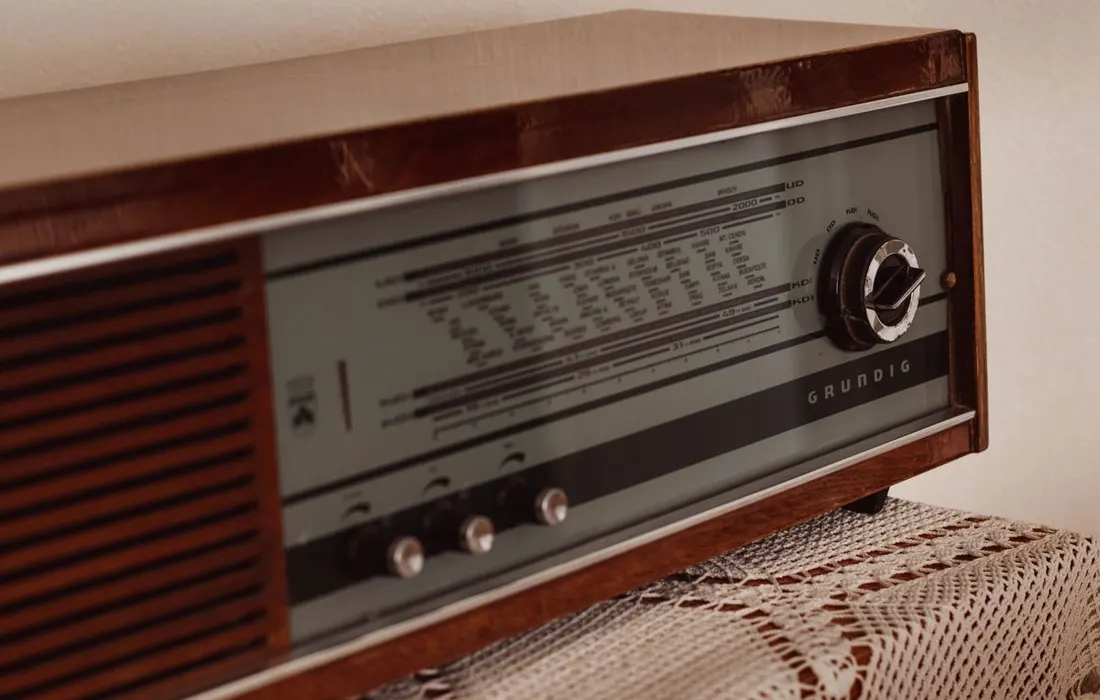 The tuning controls of a radio on a table at home.