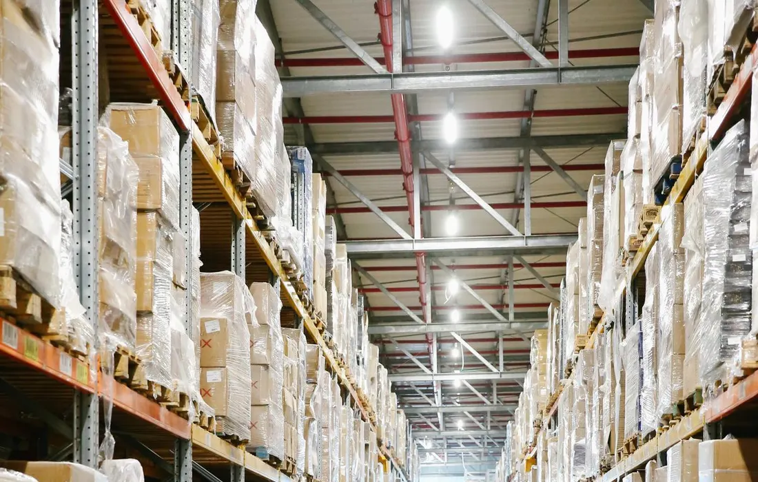 Shelving holding cardboard boxes inside a storage warehouse.