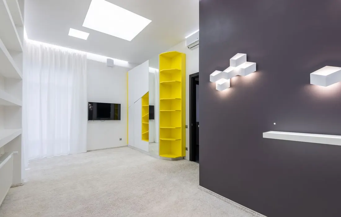 A bright furnished living room with open floor space.