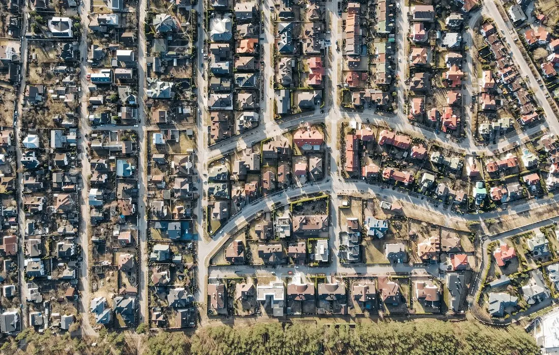 An aerial view of residential streets and houses.