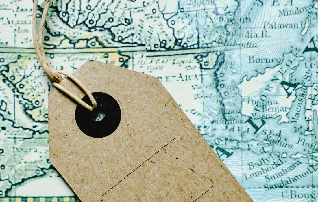 A brown paper tag resting on a map.