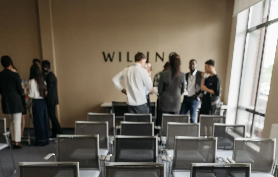 Chairs and papers arranged around a conference table.