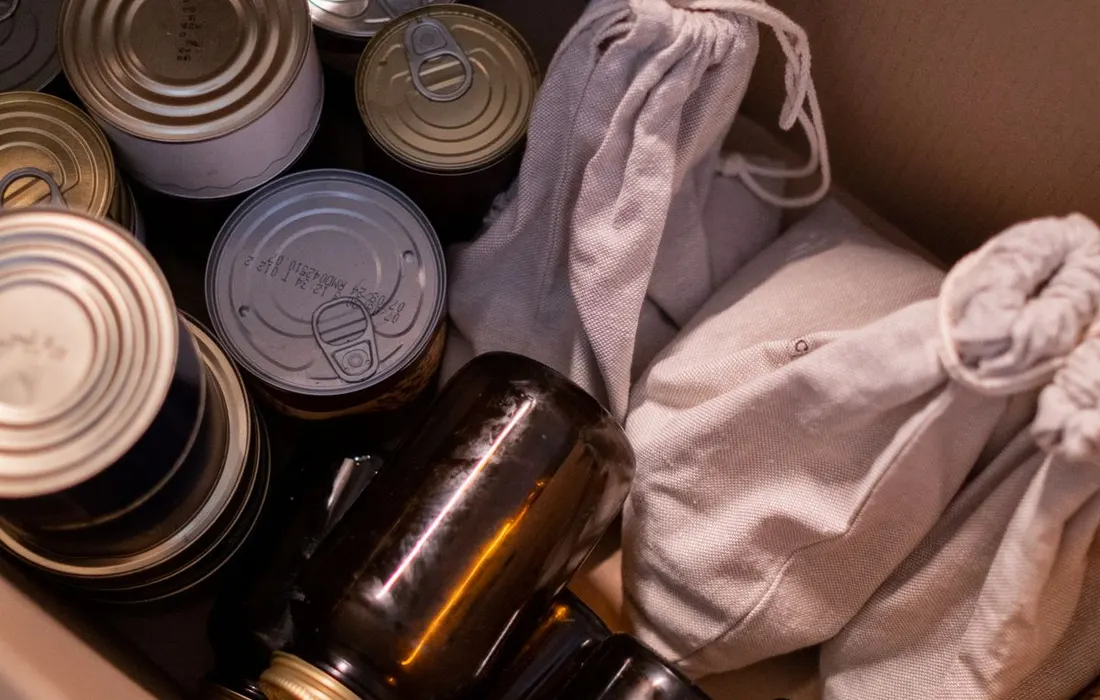 A cardboard box containing packaged food supplies.